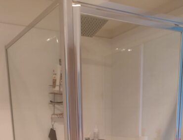 Framed shower screens installed in a new bathroom
