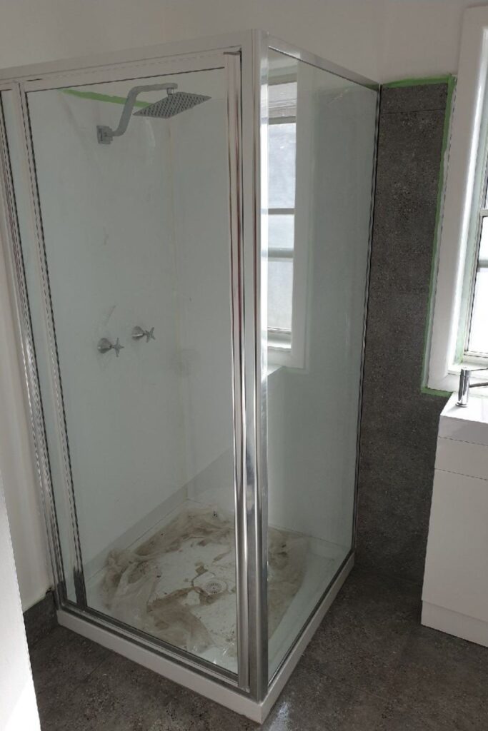 Framed glass shower screen installation