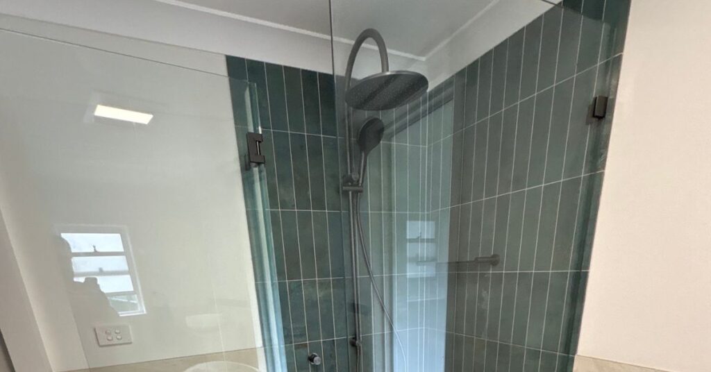 Newly installed frameless shower glass in a bathroom