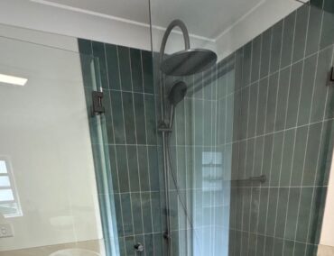 Newly installed frameless shower glass in a bathroom