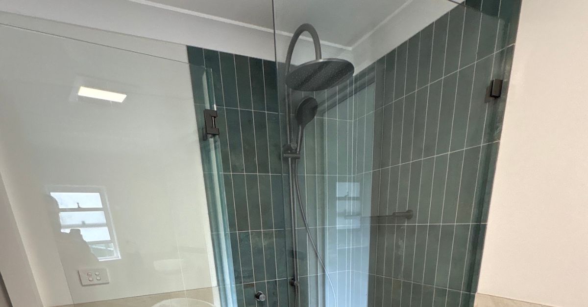 Newly installed frameless shower glass in a bathroom