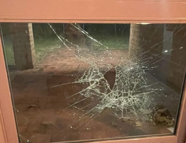 Cracked window glass with large impact spiderweb pattern